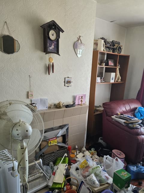 The same living room before the clearance, full of furniture and belongings